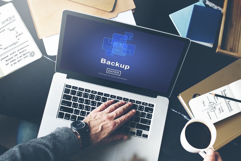 laptop with the word "Backup"