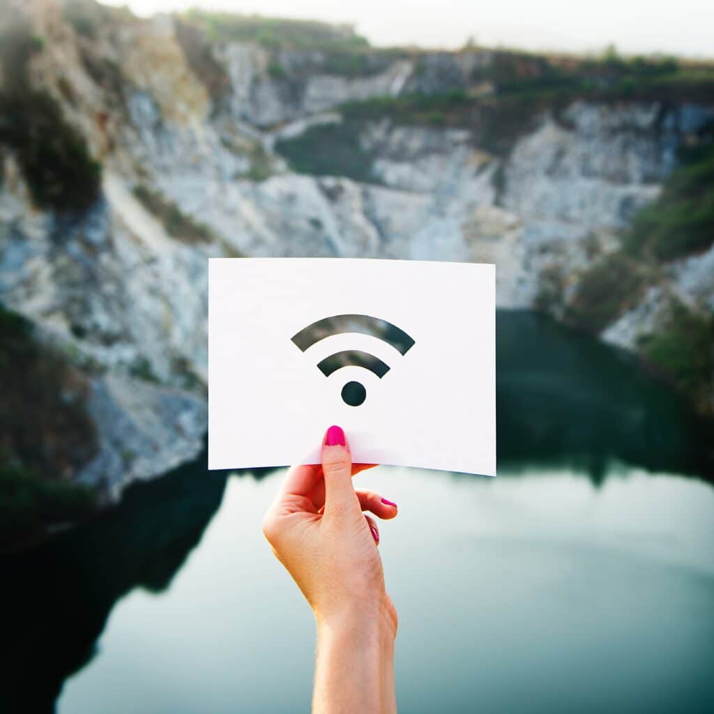 wifi signal on mountain lake background