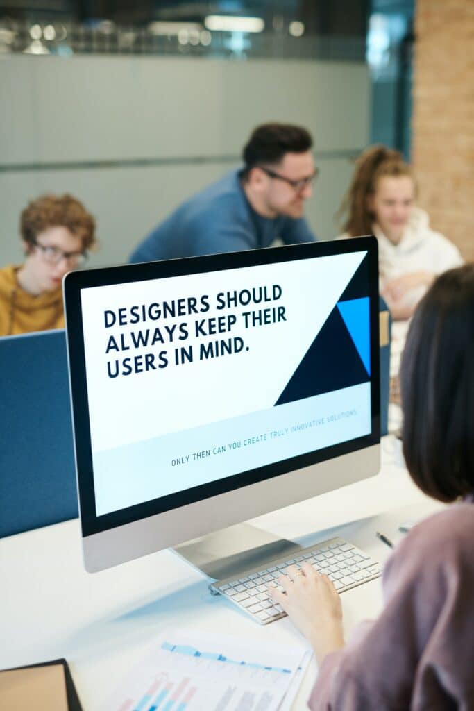 Tech Accessibility in the Workplace - computer screen with design reading "Designers should always keep their users in mind."
