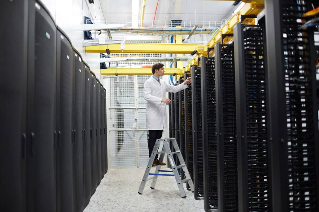 IT expert examining servers at Sherwood Park IT company