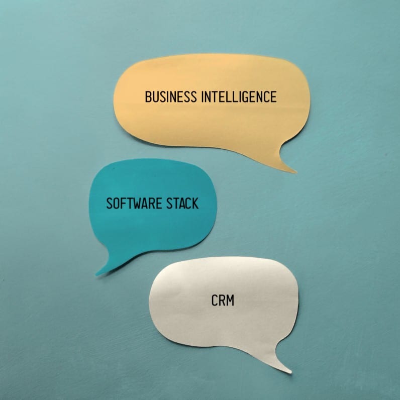 technology terms in word bubbles: business intelligence, software stack, CRM
