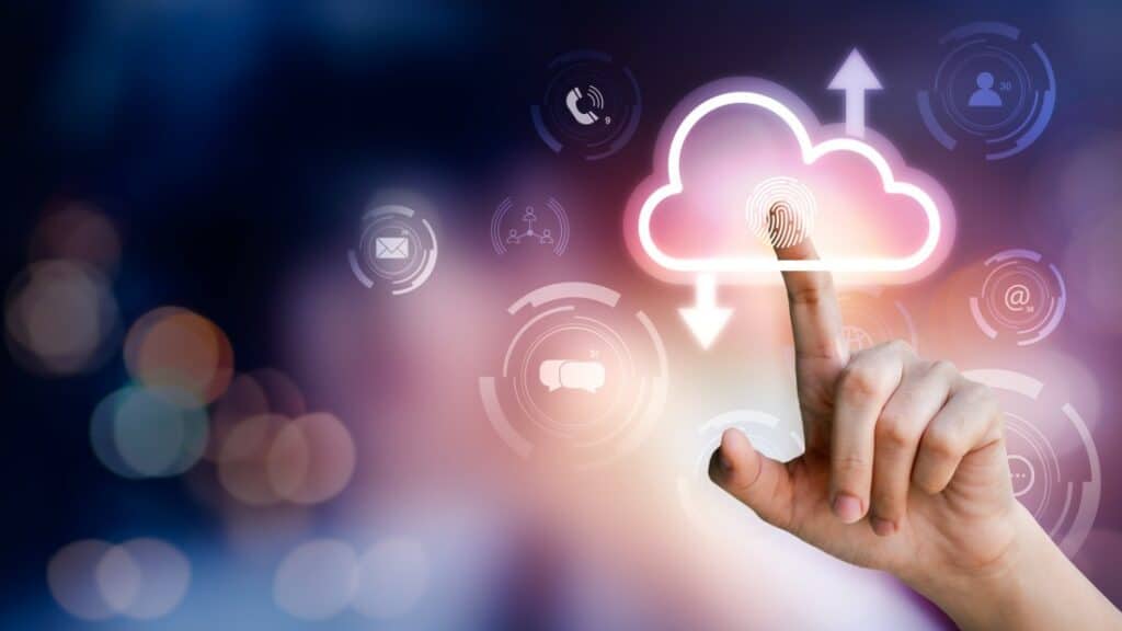 cloud services - finger selecting digital cloud icon on purple blurred background